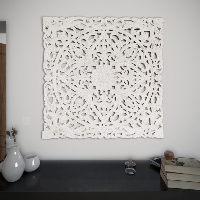 Neutral‑toned carved filigree wall frame for stylish homes