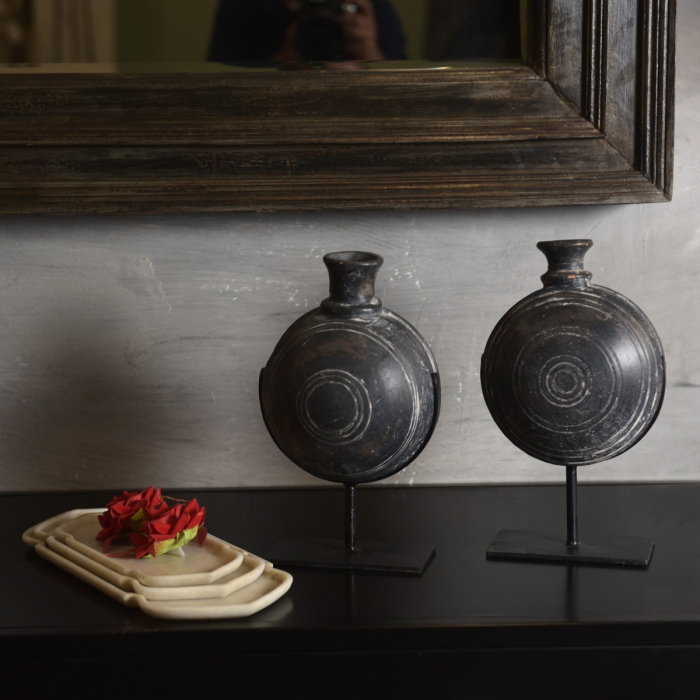Vintage clay pot on stand adding rustic village charm to interiors
