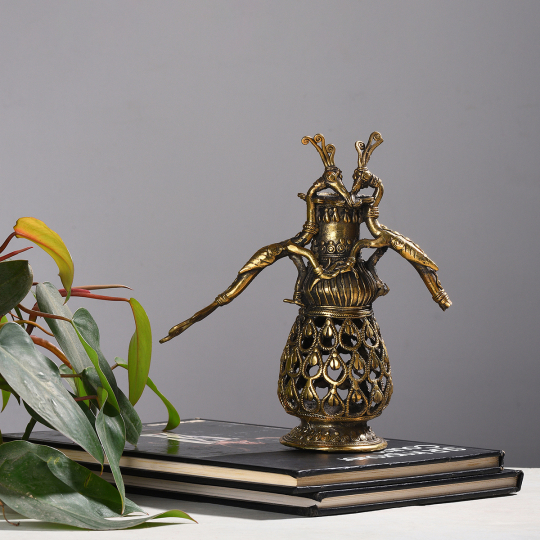 Room setting displaying the Dhokra Peacock Tea Light Holder -Shop online at Artisans Rose
