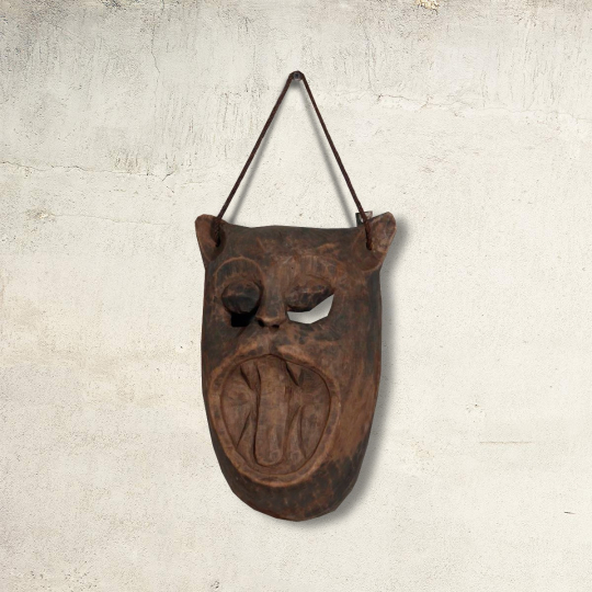 front view of Felyrine wooden bat-shaped wall mask in brown rustic finish