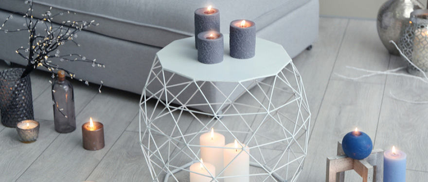 Artistic candle arrangements adding warmth to home interiors