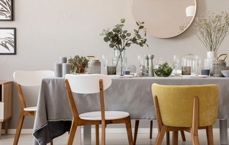 Well-styled dining table setup with coordinated tableware and tasteful home décor