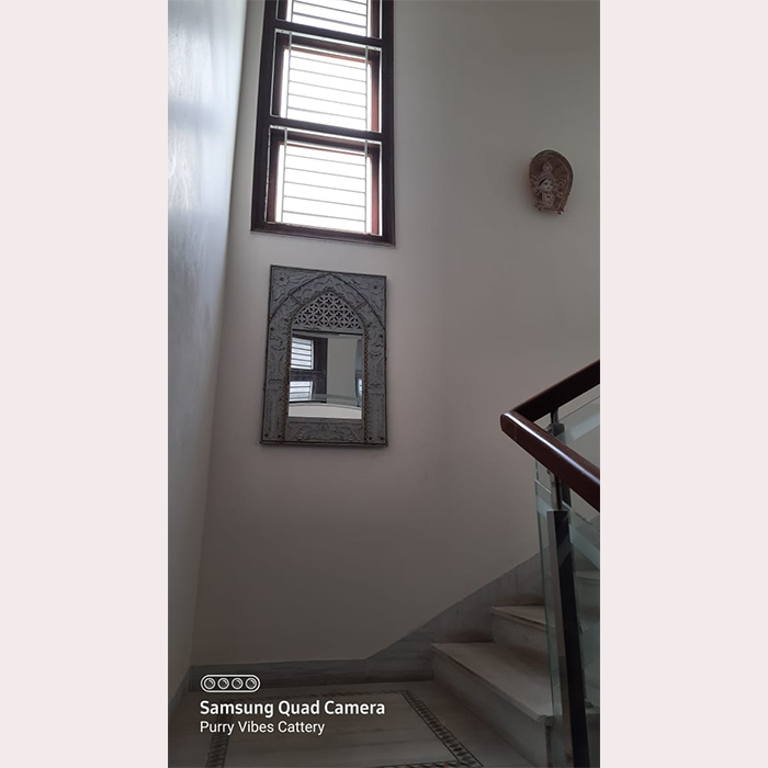 Carved minaret style wall mirror