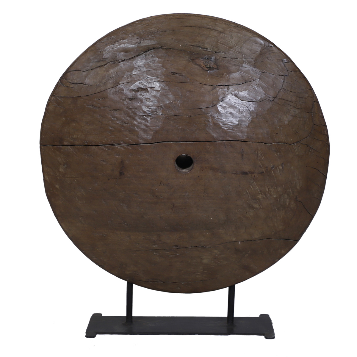 Old-style wooden wheel decor on stand for rustic home styling